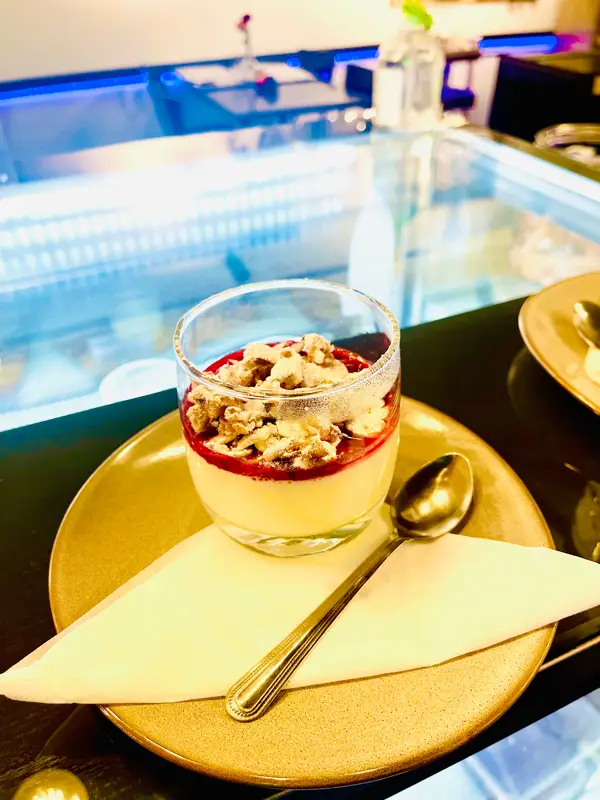Panna cotta with raspberry gel and almonds